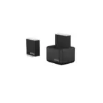 GoPro charging kit: a vertical battery charger in a docking base and a separate box with the GoPro logo on a dark surface.