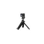 GoPro action camera mounted on a compact tripod with three extendable legs against a black background.