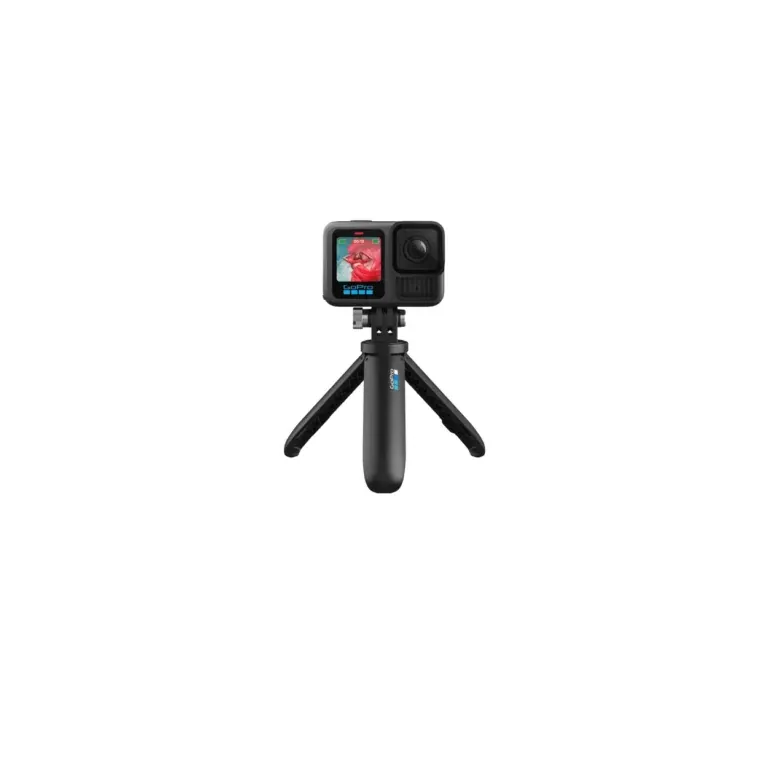 GoPro action camera mounted on a small tripod against a black background.