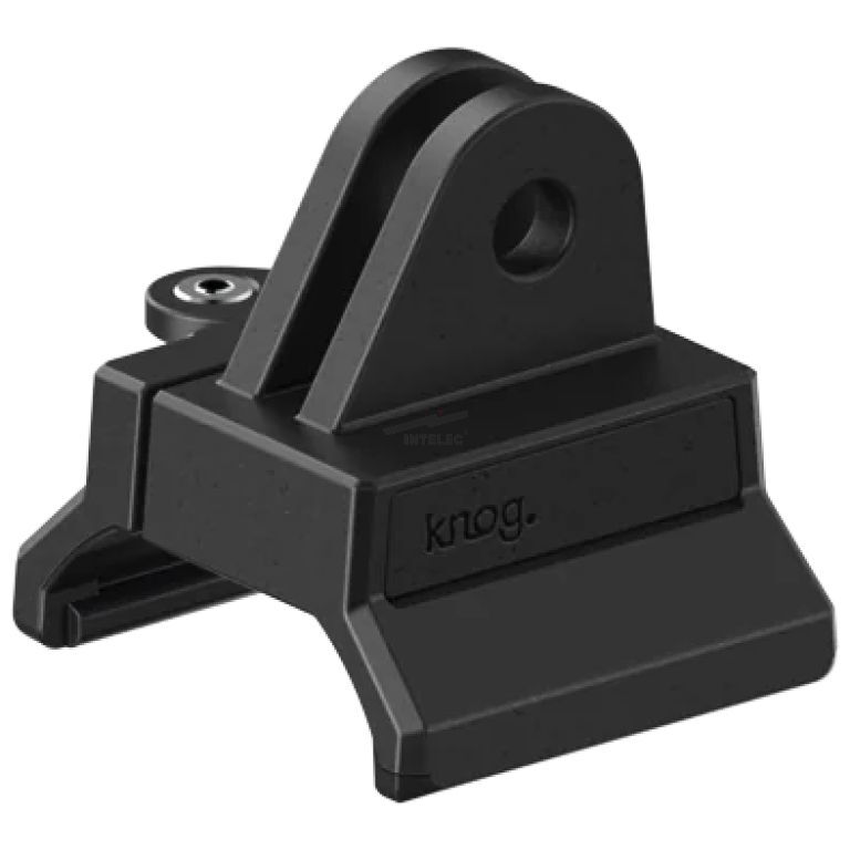 Black plastic mounting bracket with a rounded top loop for securing an accessory (Knog brand). It looks like a small clamp-style mount.