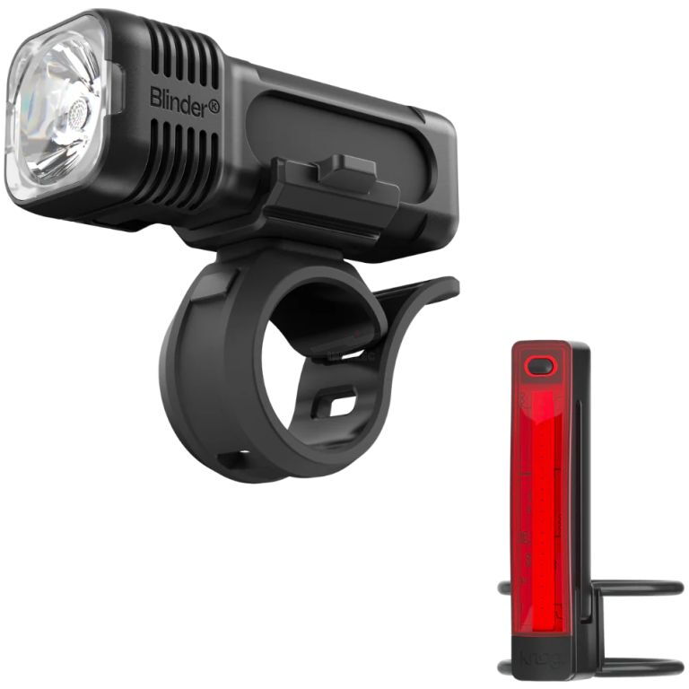 Front bicycle headlight on a circular handlebar mount with a separate red rear taillight/bracket nearby for visibility and safety.