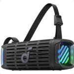 Black virtual reality headset with a wide elastic head strap and rainbow-lit front panel.
