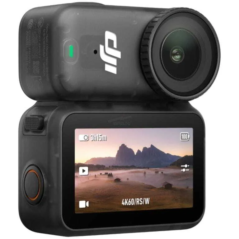 Compact action camera with a top-mounted lens module and a rear touch screen showing a landscape scene; designed for 4K video.