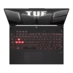 A black Asus TUF Gaming laptop viewed from above, with red backlit keys and a large TUF branding on the lid and screen area.