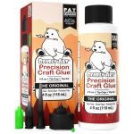 Bearly Art Precision Craft Glue kit with orange box and bottle, featuring the white bear logo and multiple tip caps for craft gluing