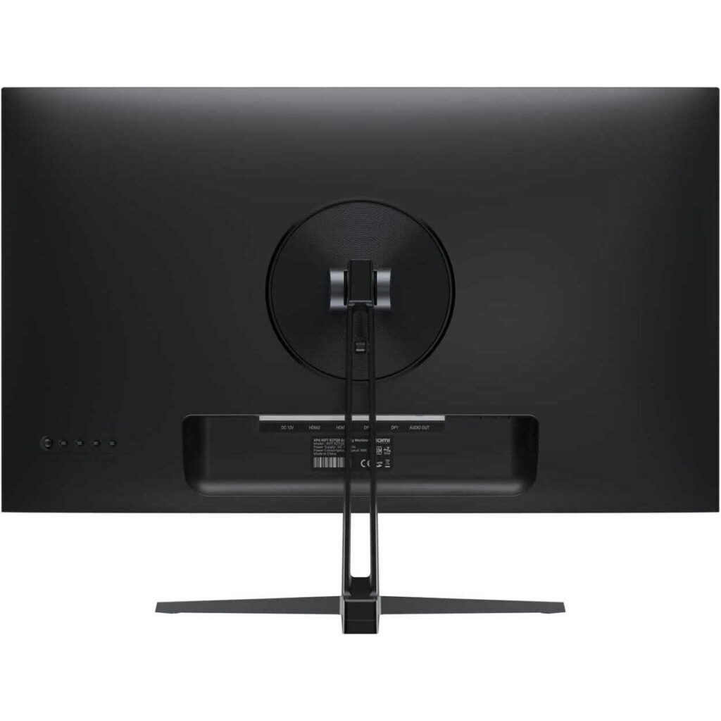Back view of a widescreen monitor mounted on a circular stand with visible cables hanging down and ports along the lower back edge.