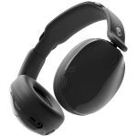 Wireless over-ear headphones in black with a skull logo on the headband, showing cushioned ear cups and a padded headband?