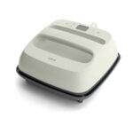Cream Cricut heat press with a digital control panel on top, angled view.