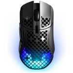 Top-down view of a black gaming mouse with a honeycomb shell and blue RGB lighting at the base, positioned for use.