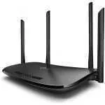 Black wireless router with four external antennas on a white background.