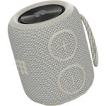 Cylindrical portable Bluetooth speaker with light gray fabric mesh and circular volume buttons plus a strap loop on the side
