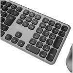 Angled view of a silver keyboard with dark rounded keys, including Inicio, Sup, Fin, and a numeric keypad nearby.