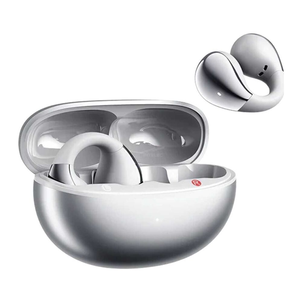 White wireless earbuds in an open charging case with a spare ear tip hovering nearby.