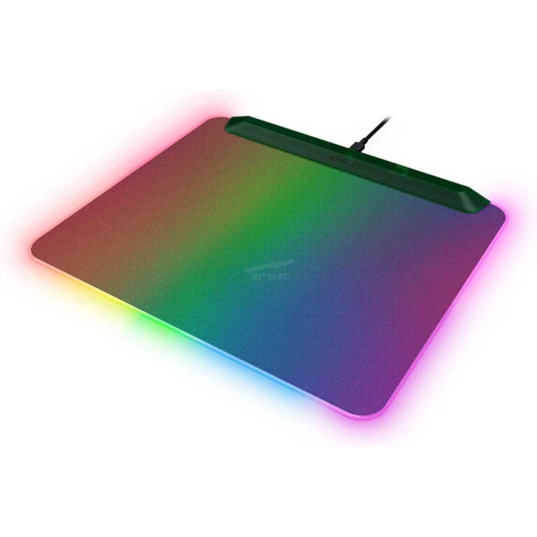 Rainbow RGB-lit gaming laptop shown at an angle, with glowing edge lighting around the chassis and a visible cable plugged in at the back.
