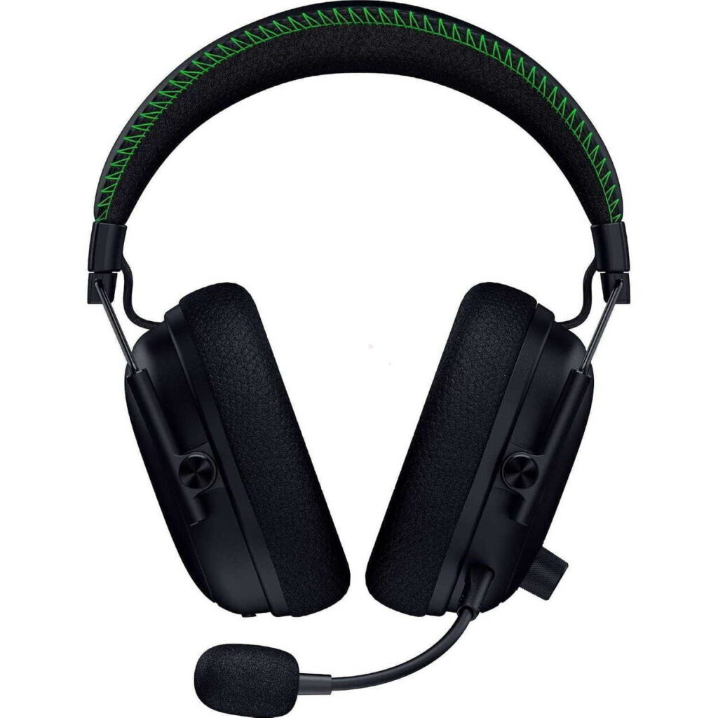 Black over-ear gaming headset with a green-stitch headband and attached boom microphone