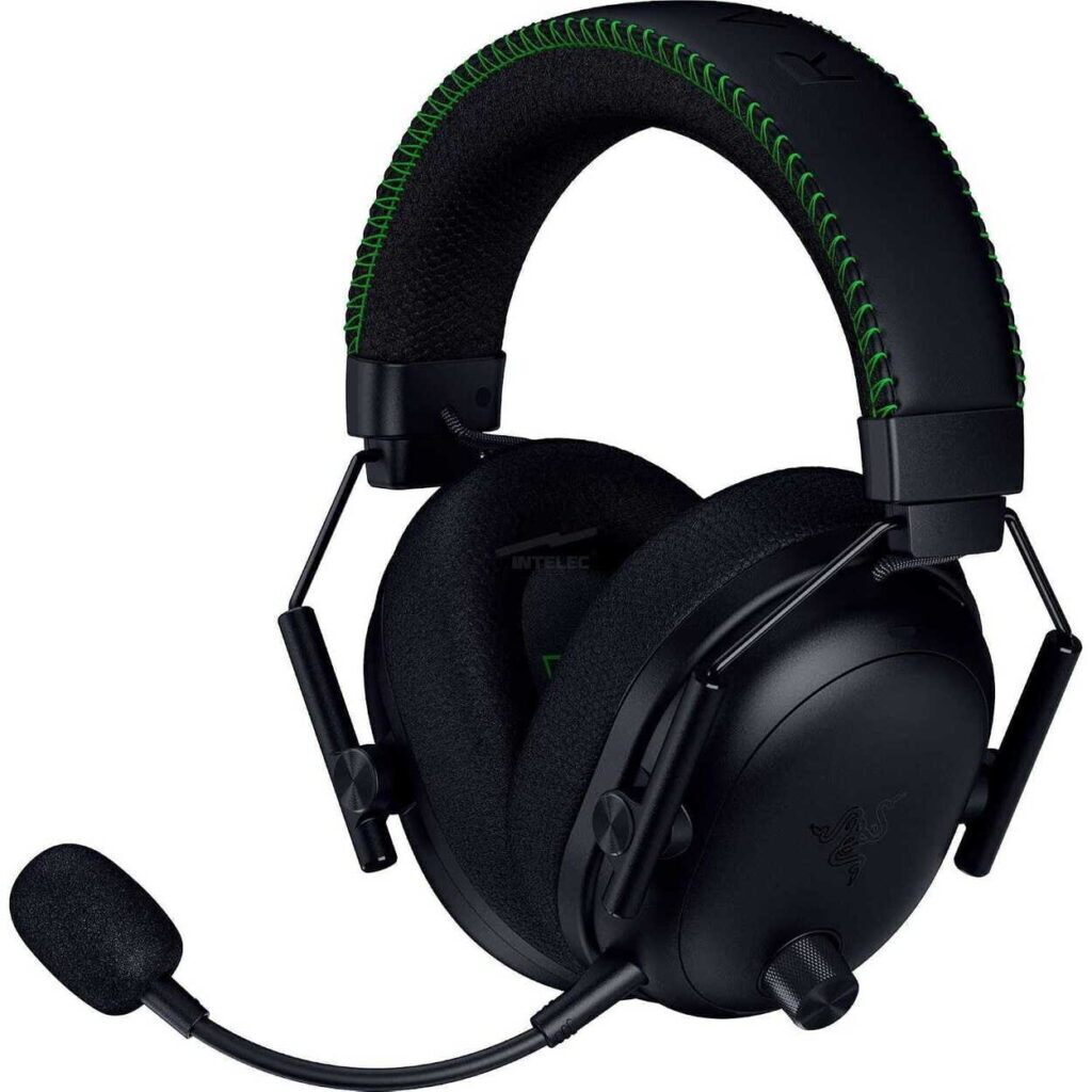 Black over-ear gaming headset with green-stitch headband and attached microphone boom