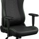 Gaming chair with black upholstery, green stitching, and padded headrest; five-wheel base and adjustable armrests.