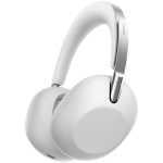 White over-ear Sony headphones with cushioned ear cups and metal headband, angled to show ear cushions and logo.