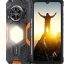 Rugged black smartphone with orange accents and a built‑in back flashlight, front display shows a person on a mountain at sunrise.