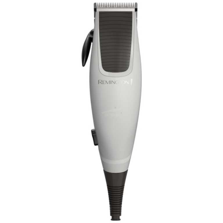 Electric hair trimmer (Remington) with a white body, black grip, and trimming blades at the top for grooming facial or body hair.