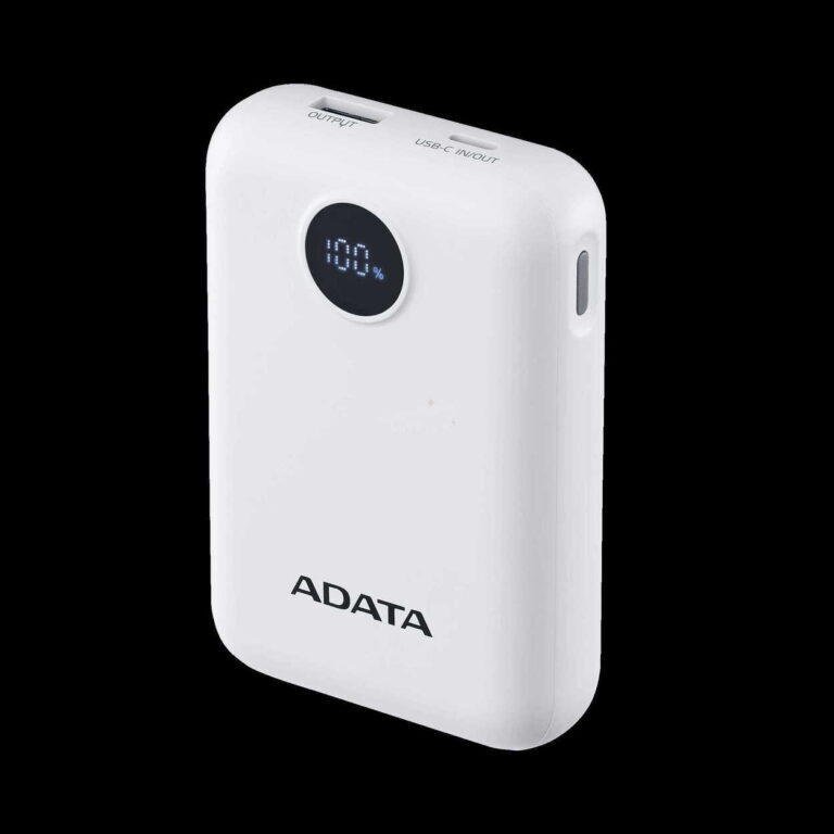 White portable power bank with a circular digital display showing 100% charge, ADATA branding, angled against a black background.