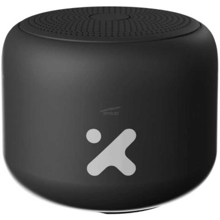 Compact black wireless speaker with perforated top grille on a rounded cube body.