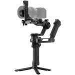 Camera mounted on a three-axis handheld gimbal with a small tripod base for stabilized shooting.