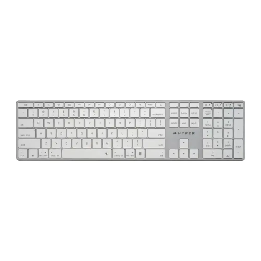 Full-size white keyboard with gray frame and numeric keypad on the right used for typing and desktop input.