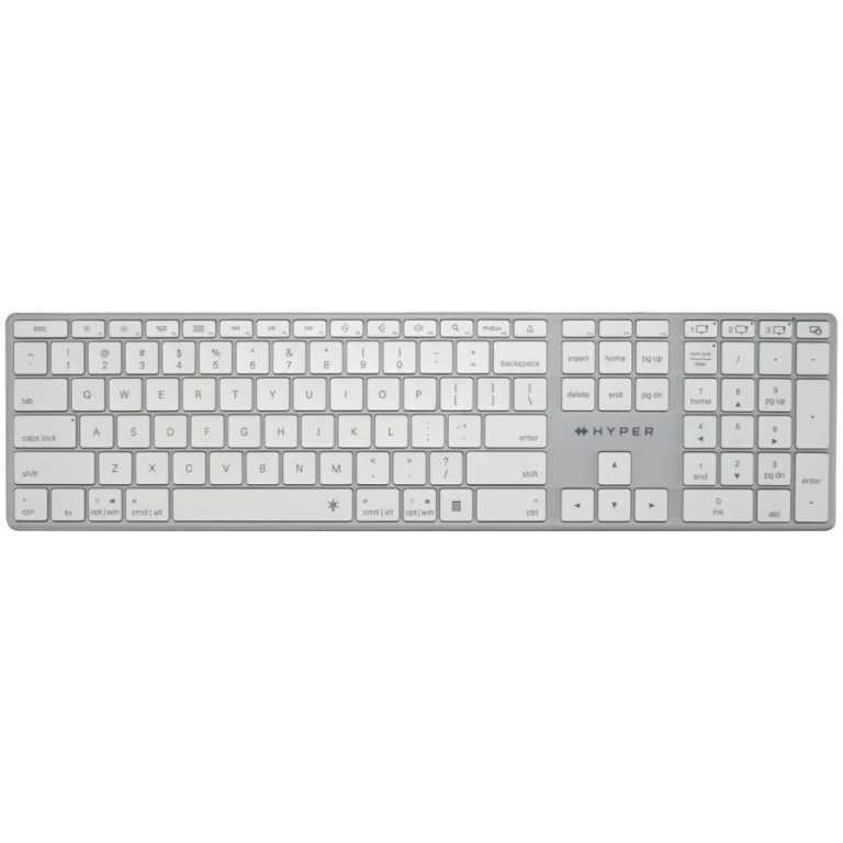 Full-size white keyboard with gray frame and numeric keypad on the right used for typing and desktop input.