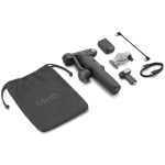 Osmo gimbal kit with accessories: pouch, handle, mounts, USB cable, and small controller sits beside it.