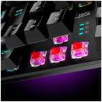 Close-up of a mechanical keyboard with pink/red transparent switches glowing under RGB lighting