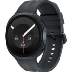 Round, dark smartwatch with a silicone strap; the display shows time, heart rate 92 bpm, date Saturday the 28th, and 3,457 steps for a fitness-tracking product image