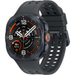 Black smartwatch with orange accents and a perforated dark strap; round display shows multiple dials and data